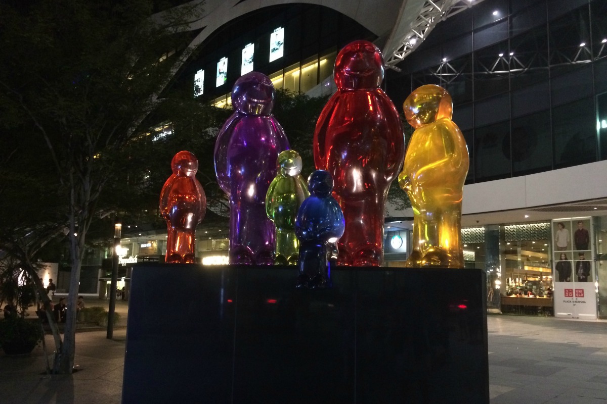 A striking statue displaying the idea of inclusivity outside one of Singapore's many shopping malls