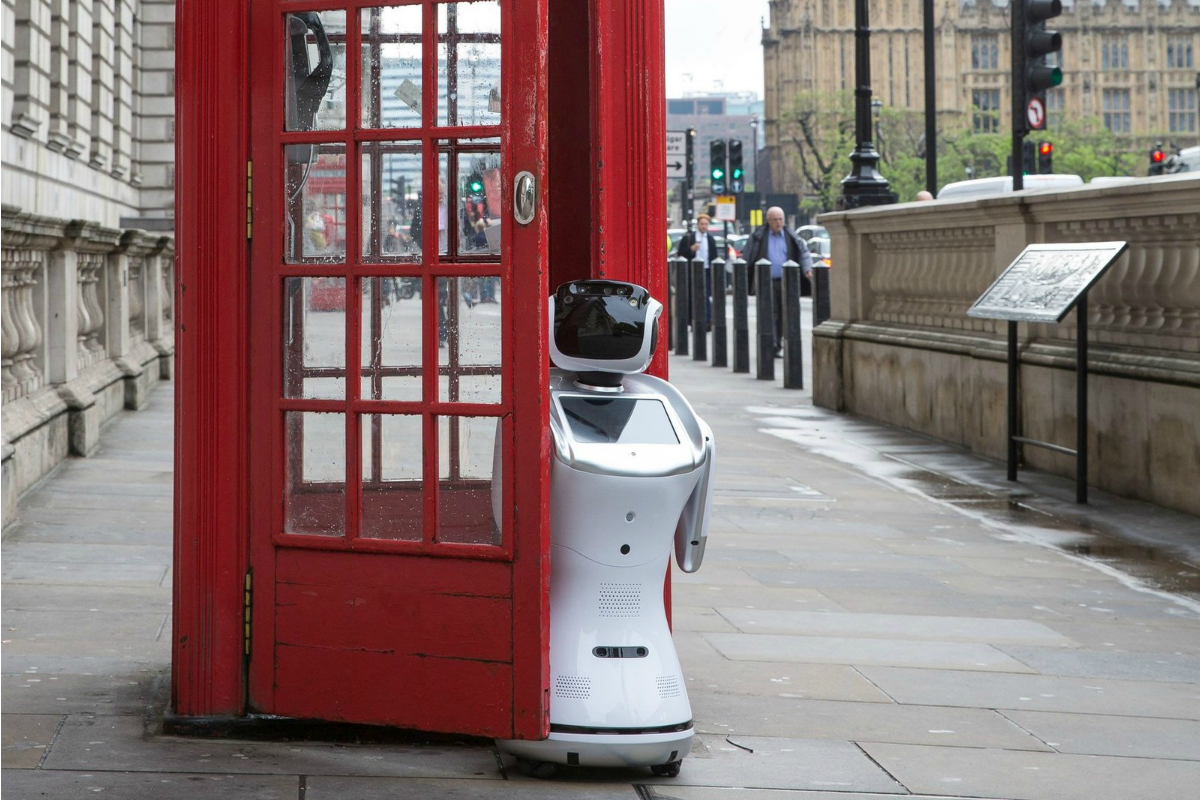 Sanbot robot poses by a phone box in front of Big Ben to promote London Tech Week