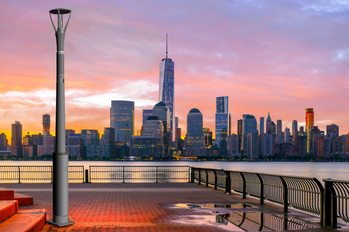 A CAD rendering of the smart pole on to an image of the New York skyline 