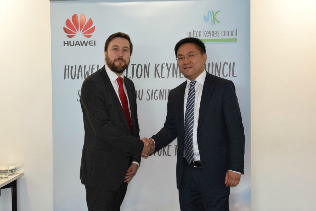 MKC leader, Pete Marland, and Gordon Luo, CEO of Huawei, sign the agreement