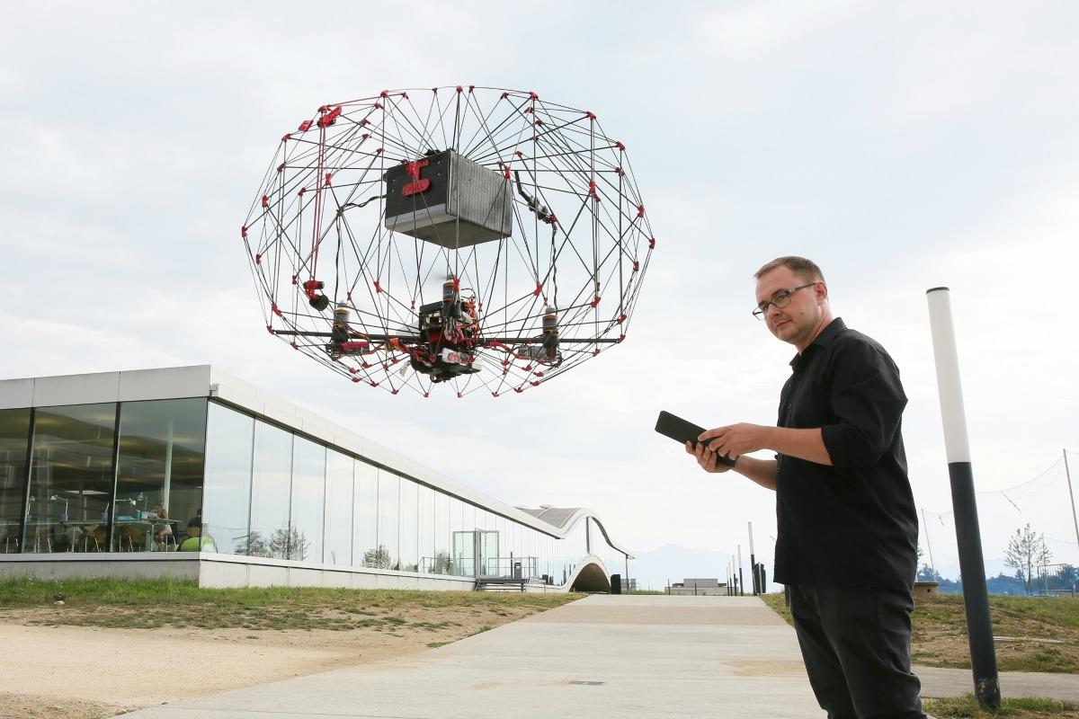 Przemyslaw Kornatowski from EPFL with his foldable, self-flying drone