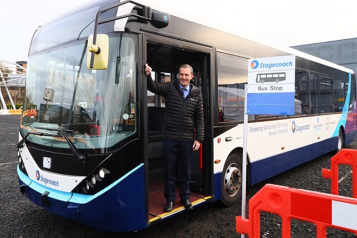 Cabinet secretary Michael Matheson with the autonomous bus