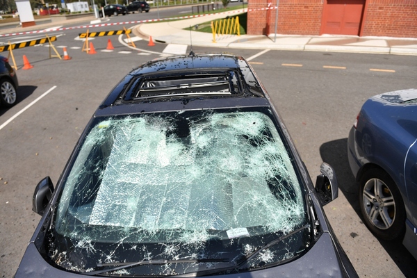 Damage from the storm caused shattered car windows and destruction of infrastructure