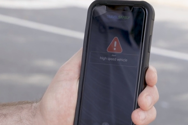 Pedestrians in Charlotte are warned of high speed vehicles approaching by the TravelSafely app