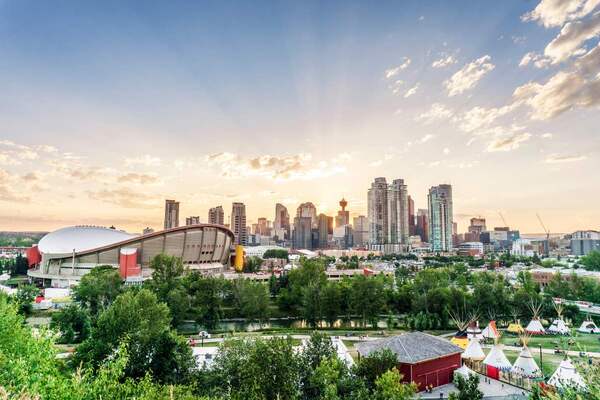Calgary with Native American village_smart cities_Adobe.jpg