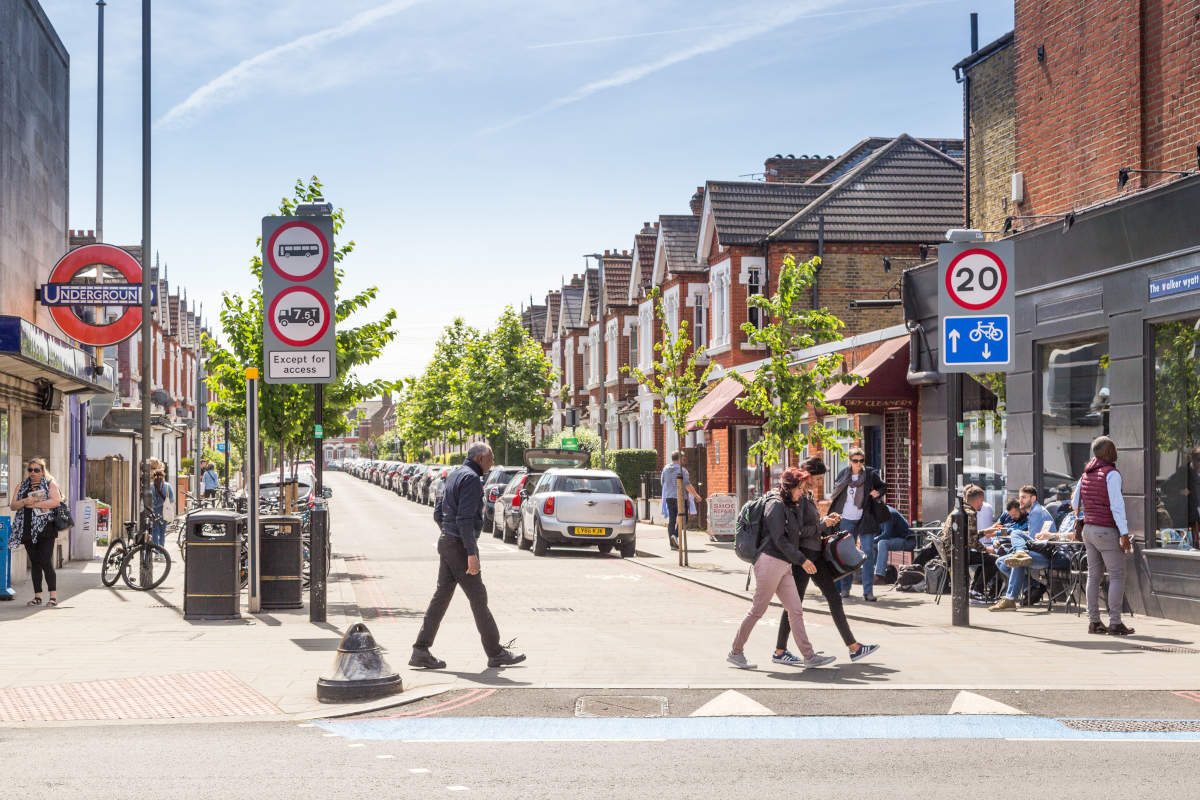 TfL Safer Streets - Pedestrians cross the road outside Tooting Bec station