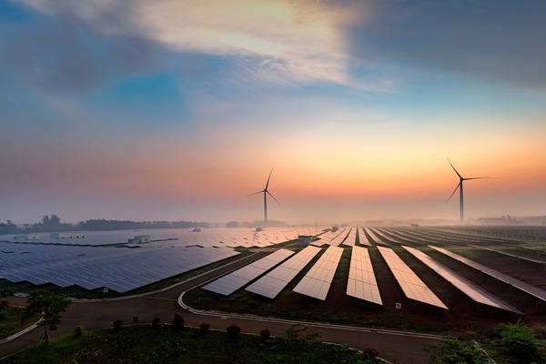 wind_turbines_and_solar_panels_at_sunrise_smart_cities_Adobe.jpg