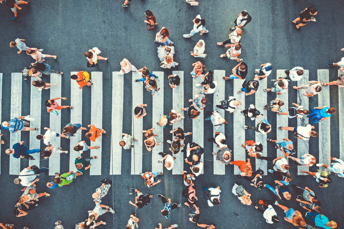 Busy city street crossing Adobe
