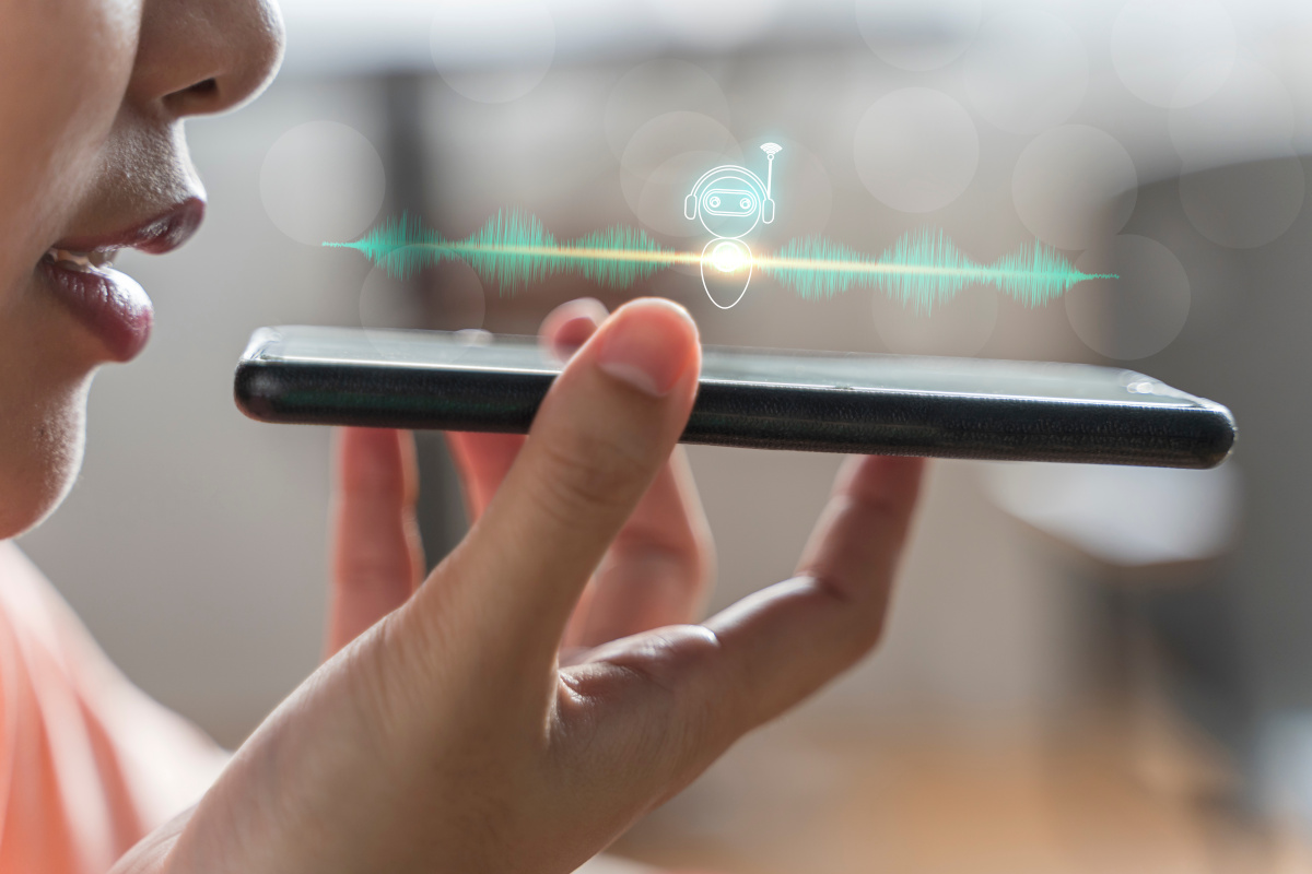 Woman talking to voice assistant on her smartphone