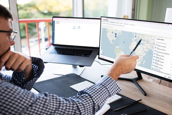man looking at traffic studies map smart cities PR man looking at traffic studies map smart cities PR